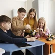 cf982fb8-156f-4034-b584-69528e5ebbc9-four-kids-building-drone-using-electronic-parts(1).jpg