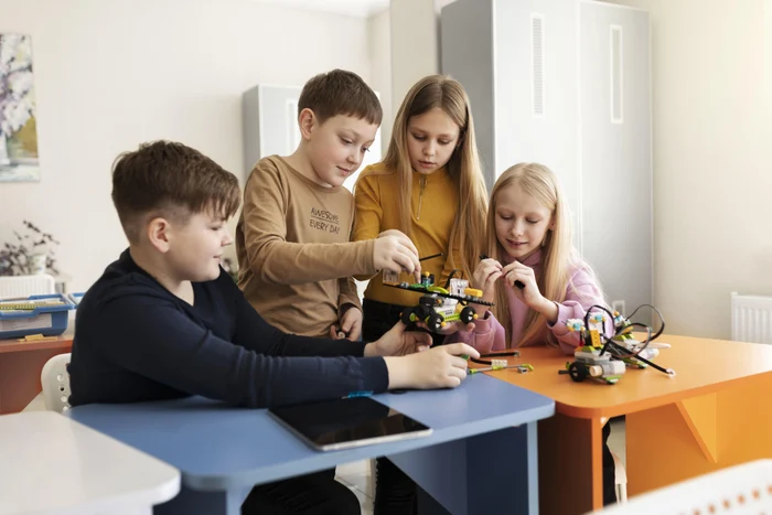 cf982fb8-156f-4034-b584-69528e5ebbc9-four-kids-building-drone-using-electronic-parts(1).jpg